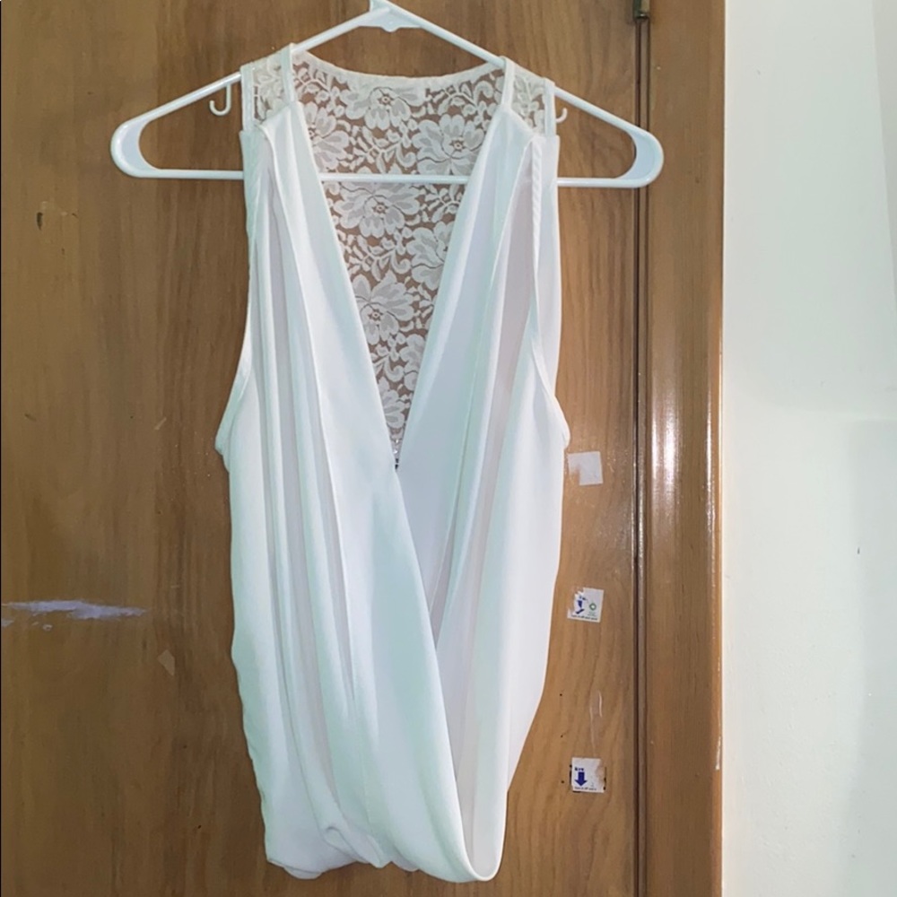 White blouse with floral back.
